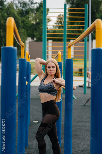 Sexy girl goes in for sports in the open air. Fitness. Healthy lifestyle