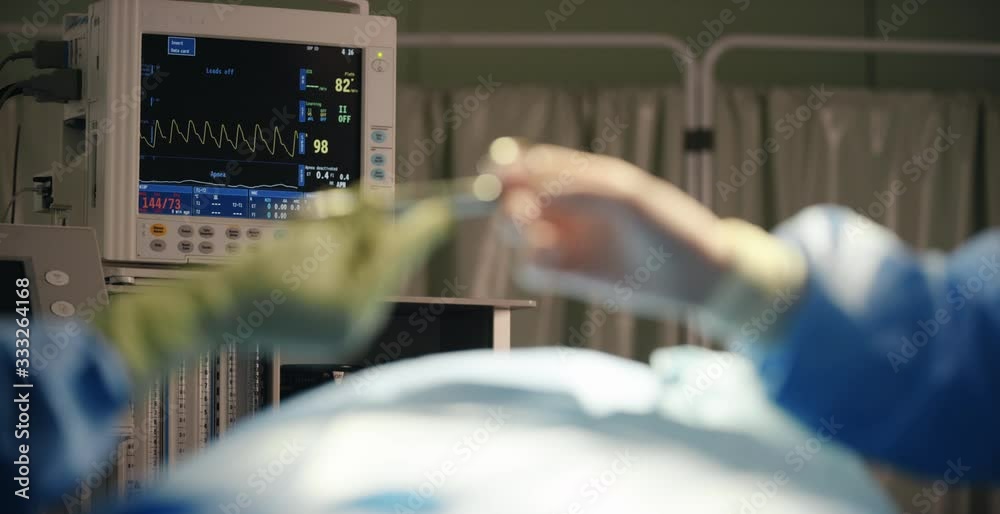Heart Rate Monitor with Hand Passing Medical Instrument