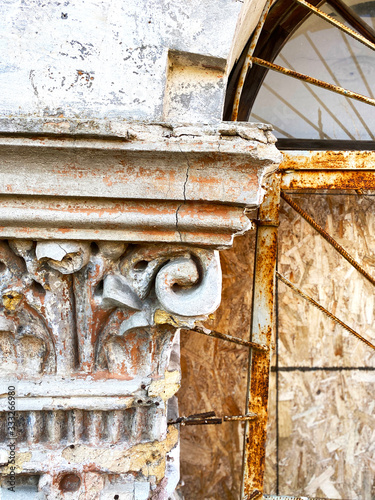 aged capital with a column photo