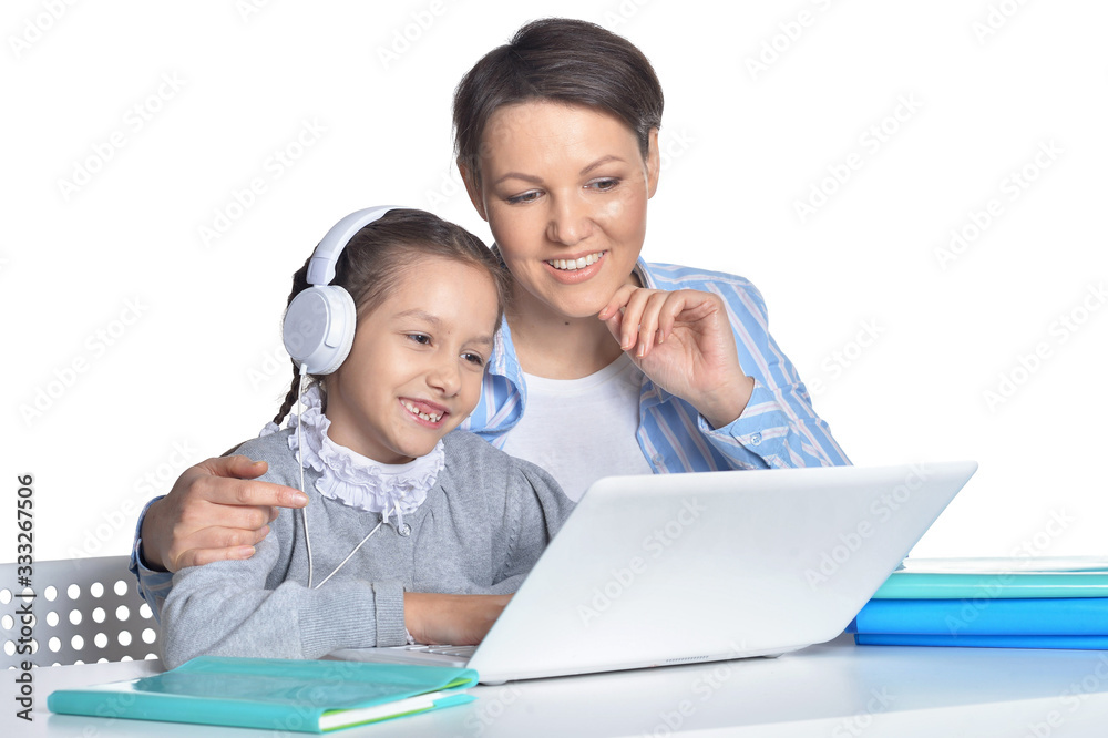 Portrait of emotional mother and daughter using laptop Portrait of emotional mother and daughter using laptop