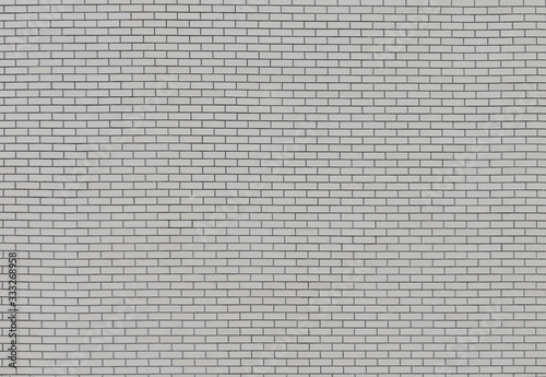 The unique texture of the wall of a house built of white smooth brick