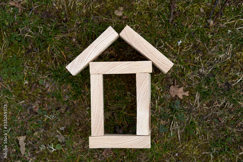 Wooden blocks in a shape of a house can be used as copy space or use for concepts Wooden blocks in a shape of a house can be used as copy space or use for concepts