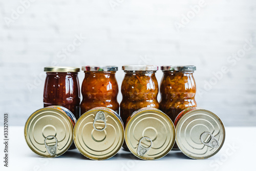 cans of canned food, long-stored foods, food supplies for a difficult situation. Cans on a white background photo