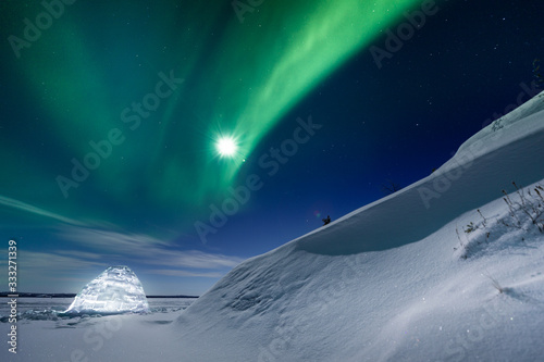 Glowing igloo under the northern lights, Yellowknife, Northwest Territories, Canada