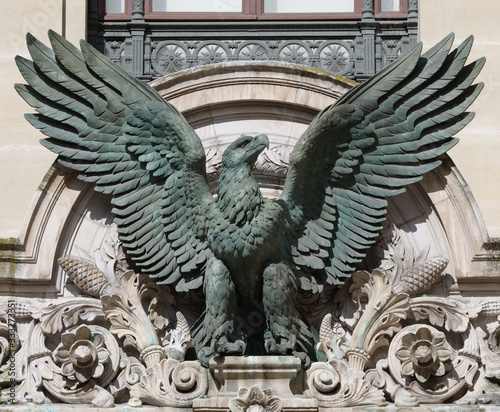 Bronze sculpture of imperial eagle on Opera Garnier in Parisabove the door of Palais Garnier, Paris, France
