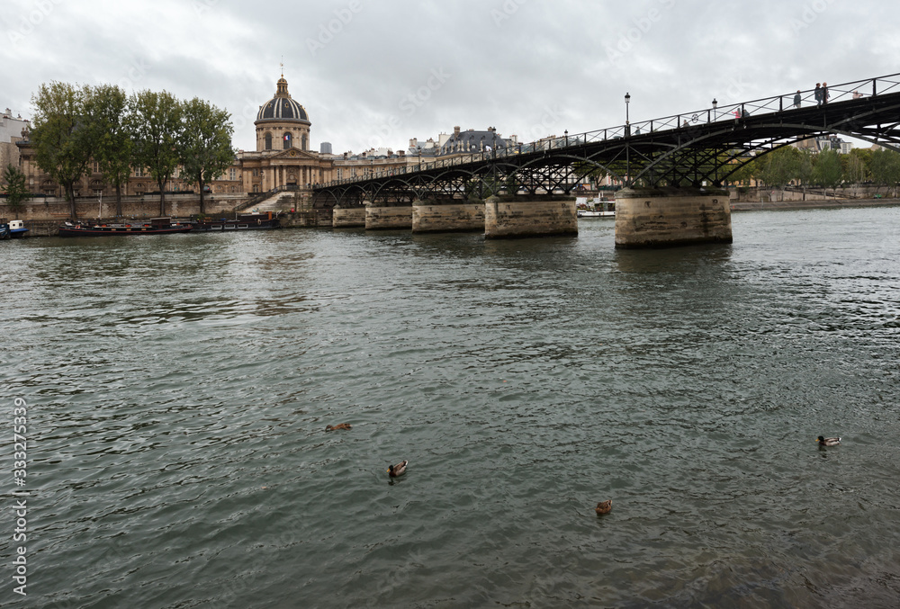 The Seine river in Paris, Pont des Arts and Institut de France in Paris