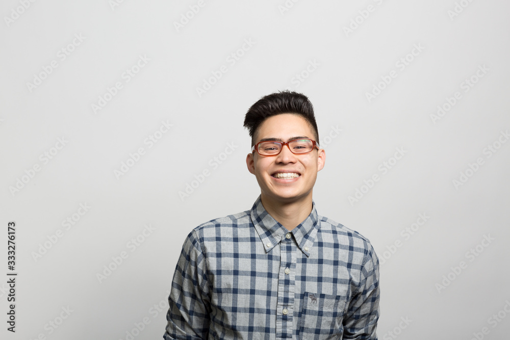 Fototapeta premium Studio portrait of an excited young man