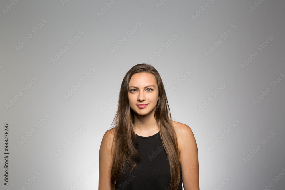 Naklejka premium Studio portrait of a thoughtful young woman
