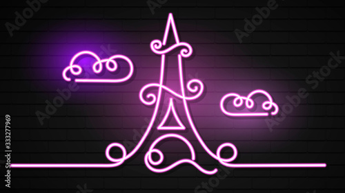 Eiffel tower in neon light on brick background
