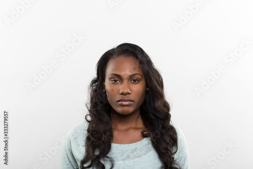 Studio portrait of a pensive young woman 