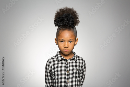 studio portrait of a pensive girl