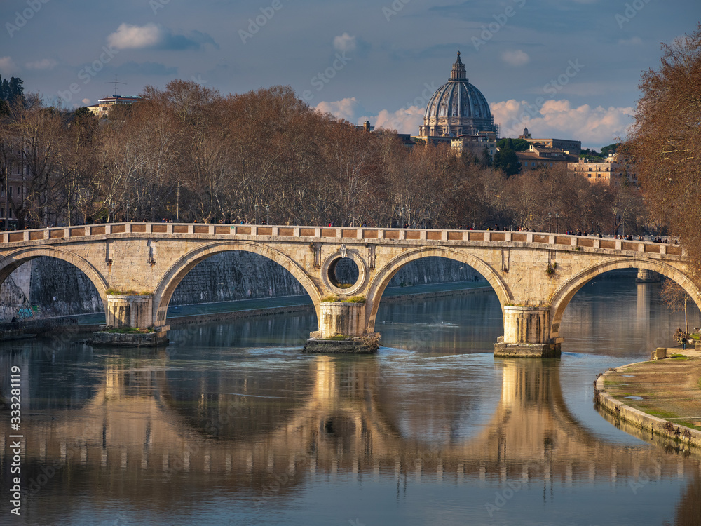 light on the bridge above river in Rome in Italy