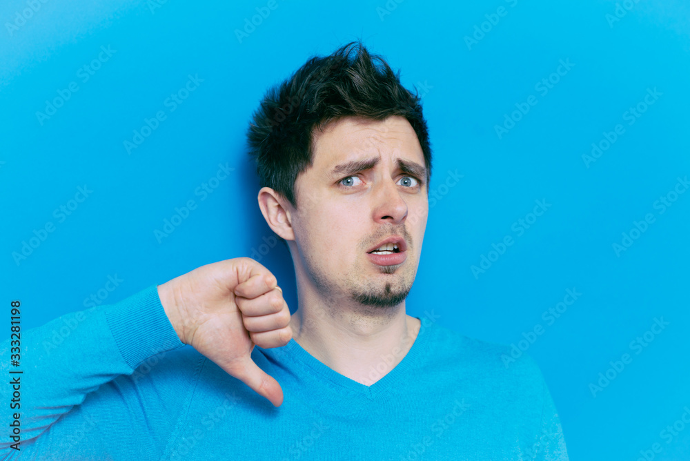 Naklejka premium man showing a thumb down gesture