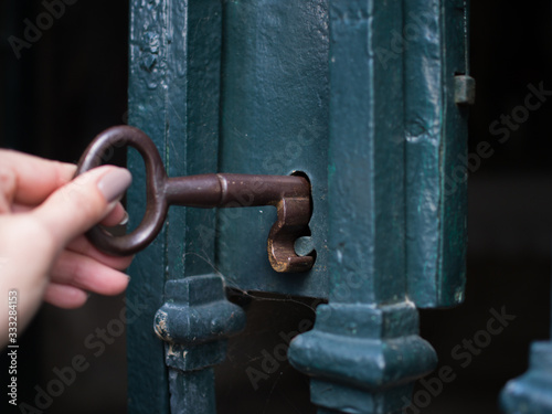 Hand hold key opening locked gate