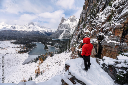 Man traveler hiking on rock in winter at Opabin Plateau in Yoho national park photo