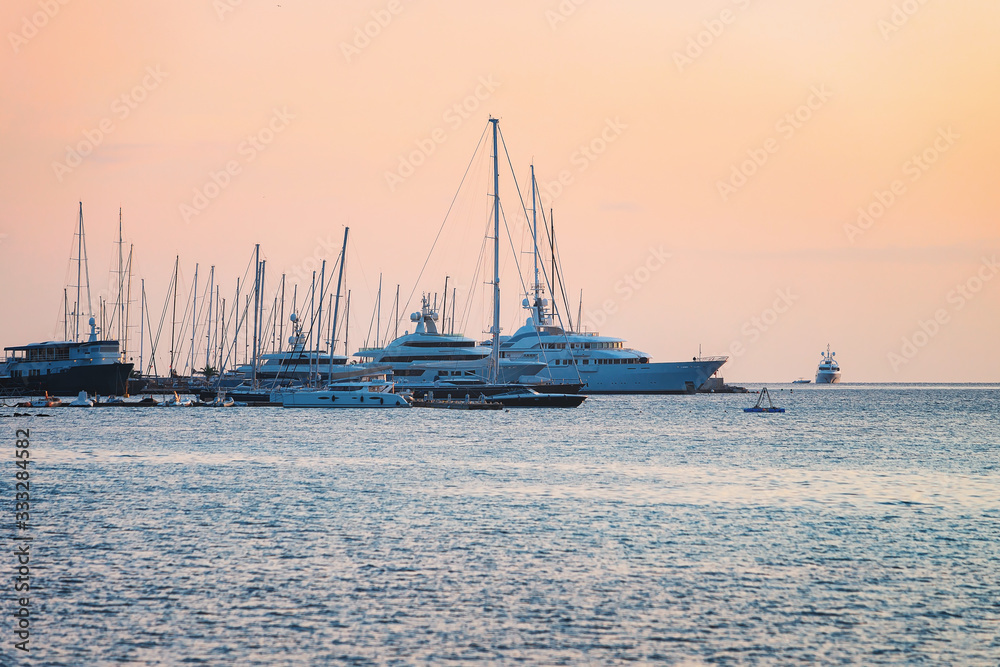 Sunrise with yachts at Costa Smeralda at Mediterranean sea Sardinia