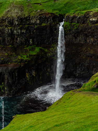 Faroe Islands. M  lafossur Waterfall. Vertical. Long exposure.