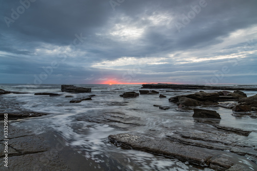 Sunrise Seascape with Cloud Covered Sky from Rocky Inlet