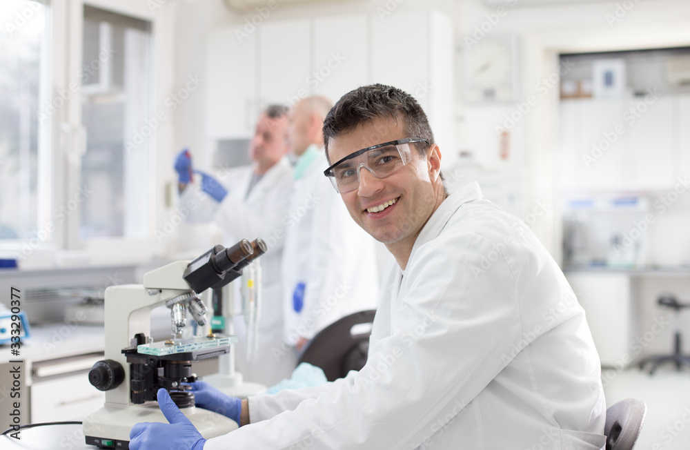 Biologists working in laboratory Biologists working in laboratory