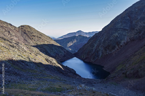 Estany Negre lake in Pyrenees mountains, trekking trail in Andorra to Pico de Coma Pedrosa summit