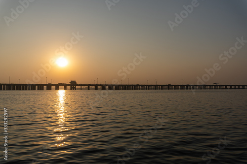 Bridge in the sea at sunset moment © Vitali