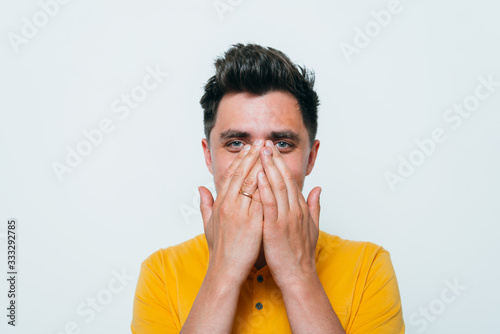 man laughs and covers her mouth