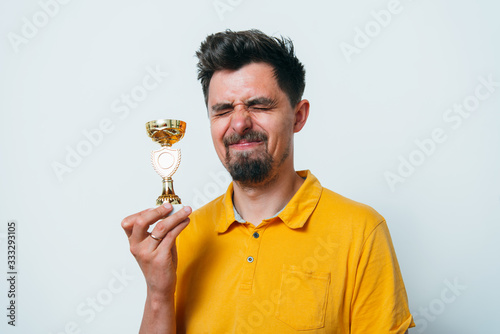 man with a golden cup
