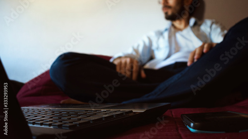 businessman man sitting working from home on a computer