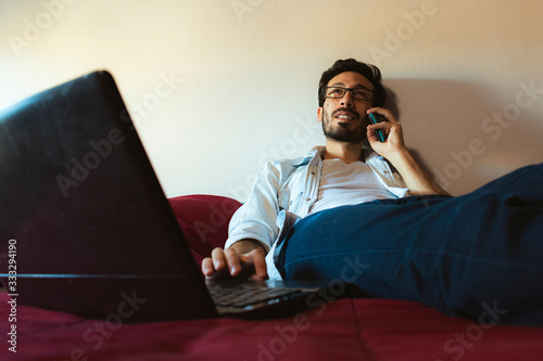young freelancer working at home typing on a computer