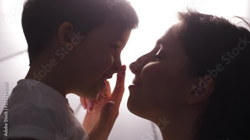 mother and son in white t-shirts on a white background