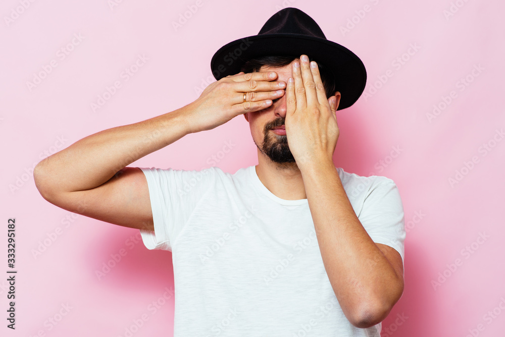 Man closes eyes with her hands Man closes eyes with her hands