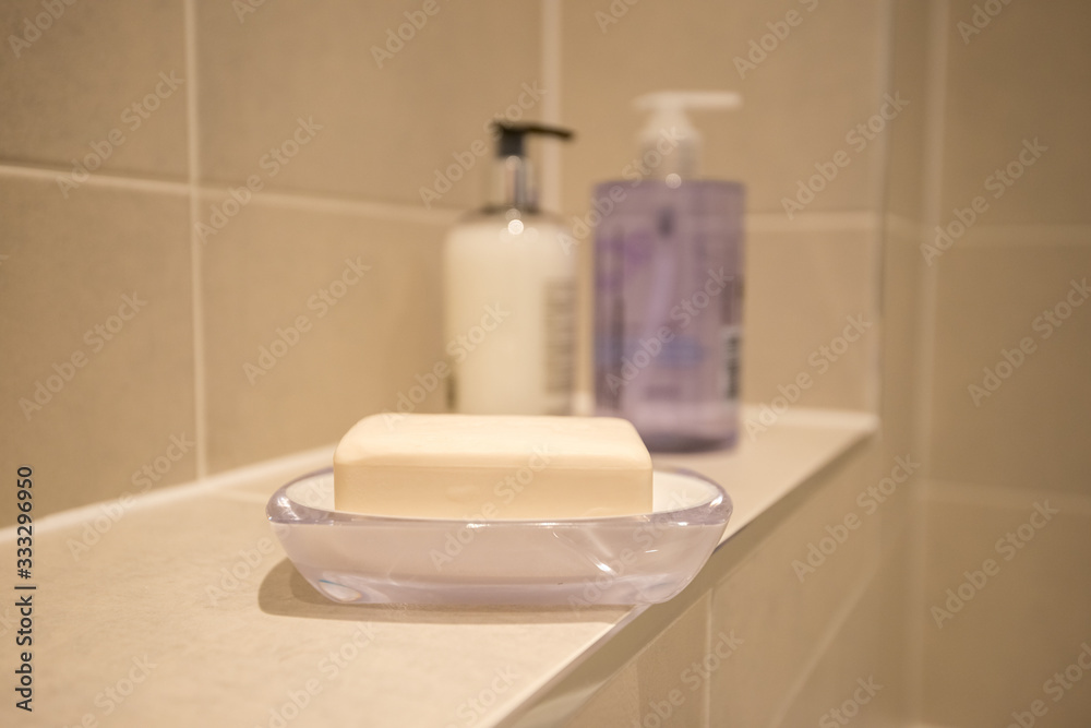 Old Fashioned Plane White Soap on Bathroom Sinc Recommended for washing hands to beat Covid-19 Corona Virus. Old Fashioned Plane White Soap on Bathroom Sinc Recommended for washing hands to beat Covid-19 Corona Virus.