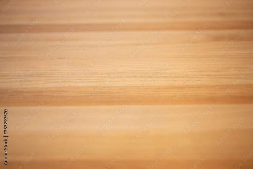 A closeup view of a smooth wood surface background.