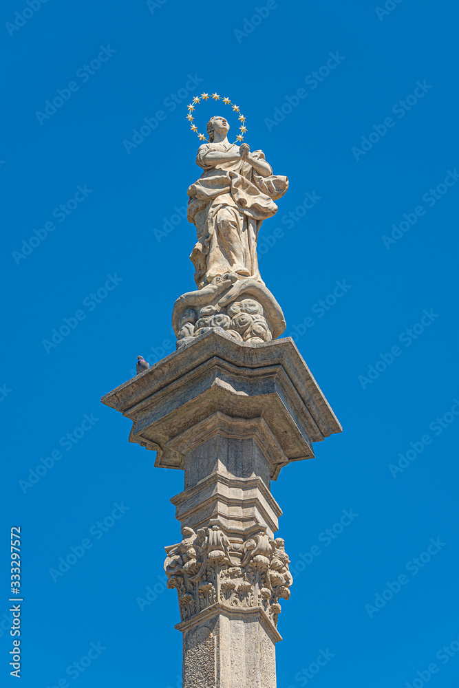 Statues at Marian Column or Holy Trinity at Hradcanske Square for bubonic plague pandemics in Prague, Czech Republic, details, closeup