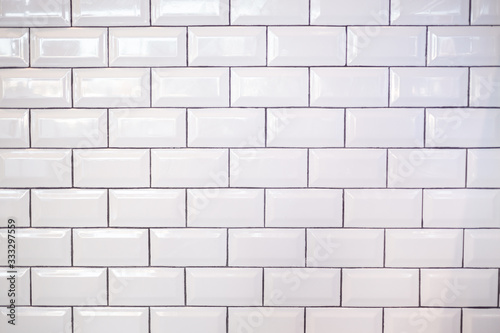 A background of white modern subway tile.