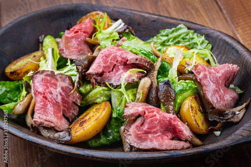 beef salad with vegetables and herbs