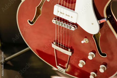 A closeup view of an archtop guitar at a music store.