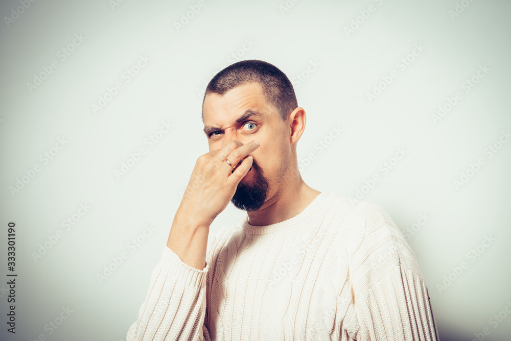 The stench. Closes the man's nose The stench. Closes the man's nose