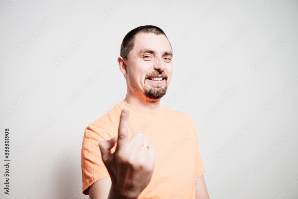 Fototapeta premium Young man showing his index finger towards the camera