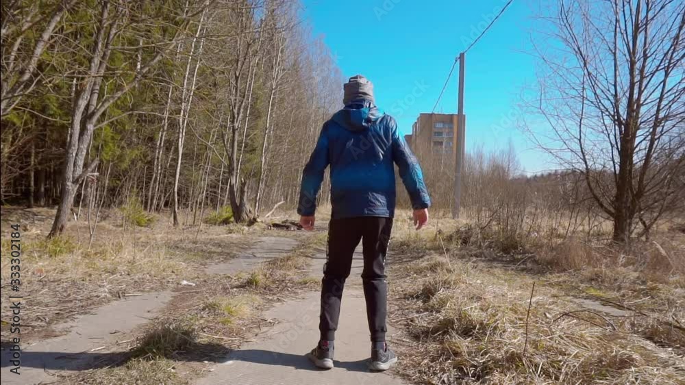 teenager funny dances on a dull abandoned construction site teenager funny dances on a dull abandoned construction site