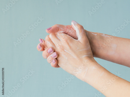 Closeup of woman washing hands. Hygiene and body care concept.