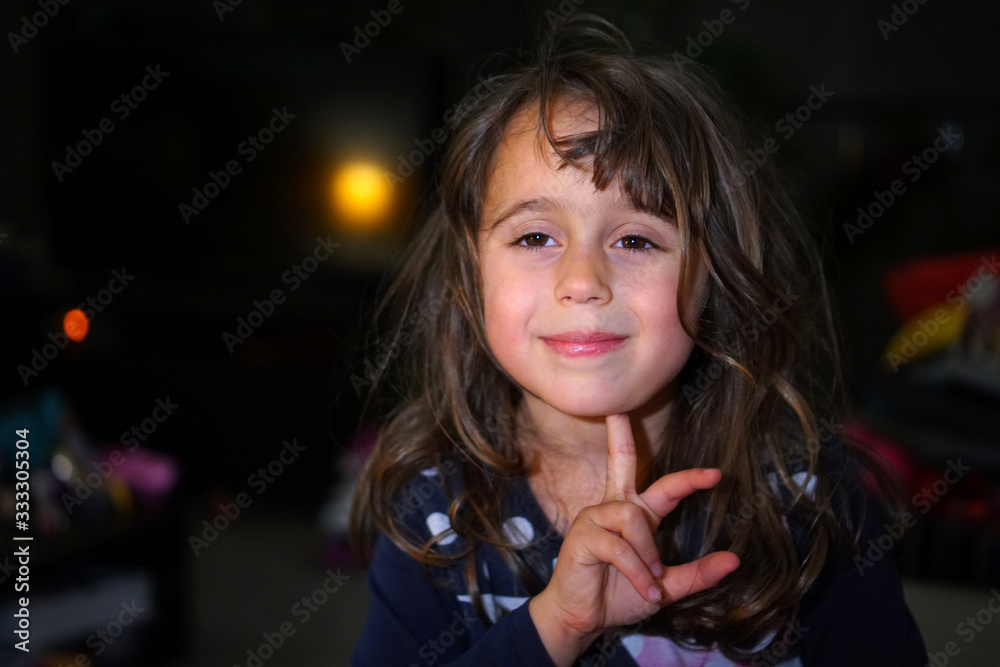 little girl with big eyes make funny faces, with copy space little girl with big eyes make funny faces, with copy space
