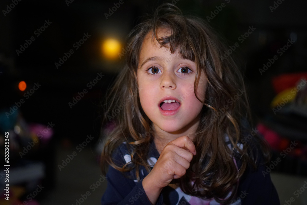 little girl with big eyes make funny faces, with copy space little girl with big eyes make funny faces, with copy space