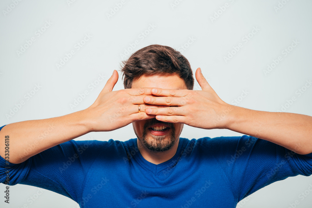 Man closes eyes with her hands Man closes eyes with her hands