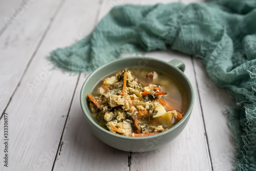 Fresh green sorrel soup, Russian special egg drop soup with vegetables, healthy soup