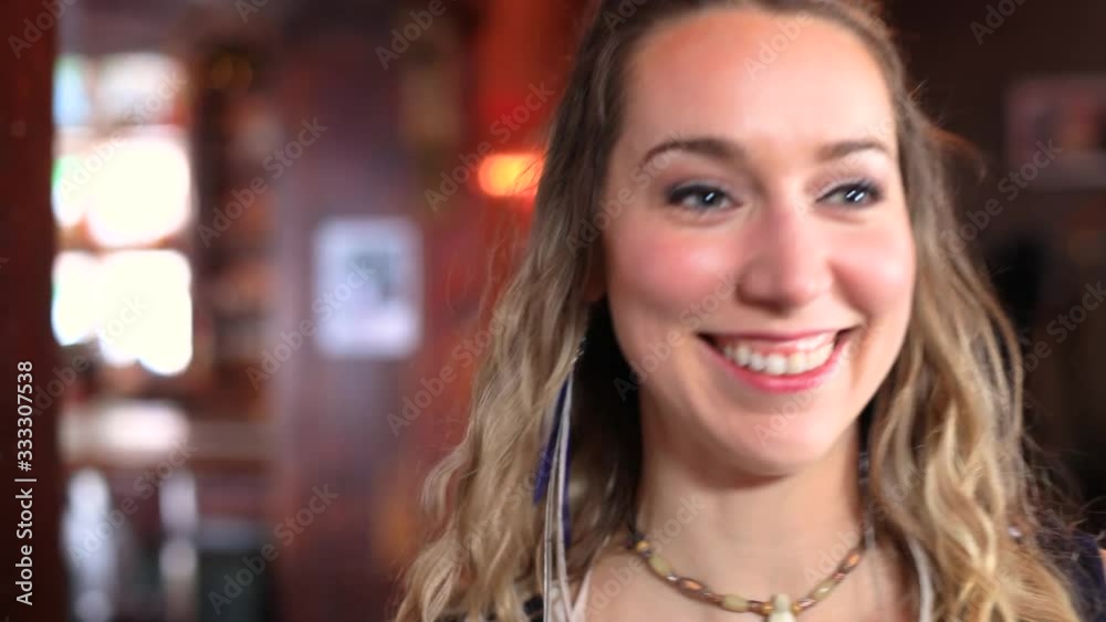 Portrait of confident young woman with a broad toothy smile walking towards platform share thoughts and interact with the audience Portrait of confident young woman with a broad toothy smile walking towards platform share thoughts and interact with the audience