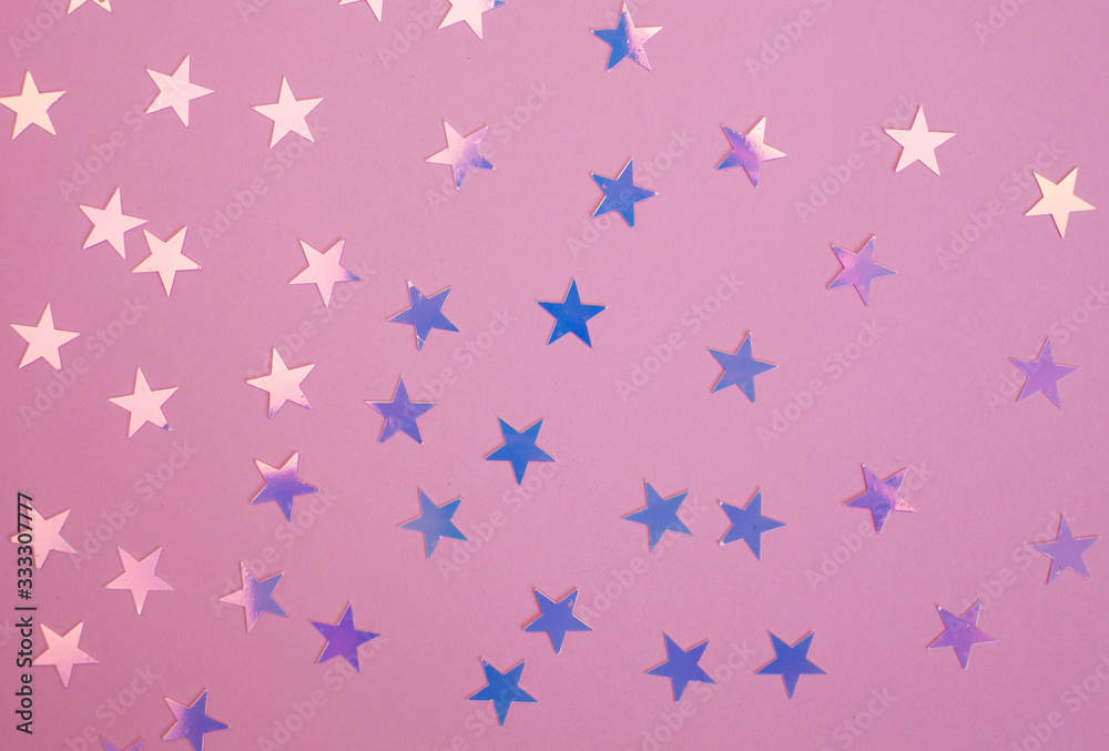 Pink and purple shiny star confetti over pink background. Pink and purple shiny star confetti over pink background.