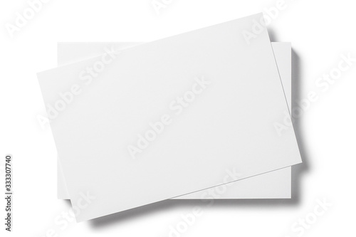 Close-up of blank cards, tickets or flyers, isolated on white photo