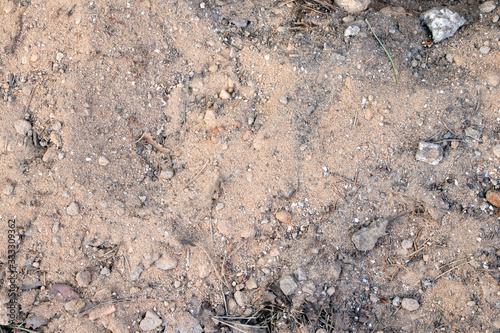 A dry ground, soil and sand with stones texture, background. Nature. photo