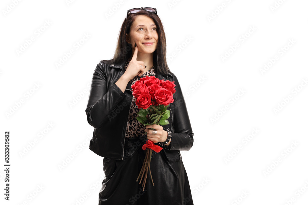 Young woman holding a bunch of red roses and thinking Young woman holding a bunch of red roses and thinking